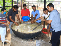   Social worker Nitesh Khandelwal and his team members  prepare ayurvedic medicine for cows after lumpy skin disease  outbreak in cattle, at...