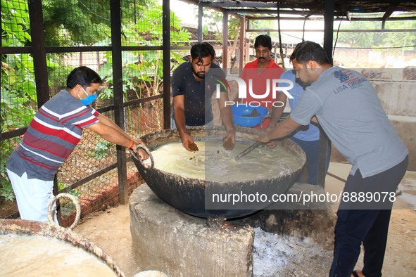   Social worker Nitesh Khandelwal and his team members  prepare ayurvedic medicine for cows after lumpy skin disease  outbreak in cattle, at...