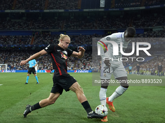 Xaver Schlager central midfield of RB Leipzig and Austria and Ferland Mendy left-back of Real Madrid and France compete for the ball during...