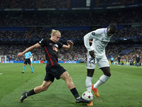 Xaver Schlager central midfield of RB Leipzig and Austria and Ferland Mendy left-back of Real Madrid and France compete for the ball during...