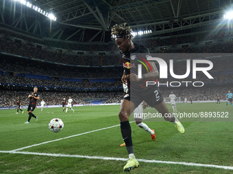 David Alaba centre-back of Real Madrid and Austria and Mohamed Simakan centre-back of RB Leipzig and France compete for the ball during the...