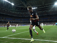 David Alaba centre-back of Real Madrid and Austria and Mohamed Simakan centre-back of RB Leipzig and France compete for the ball during the...