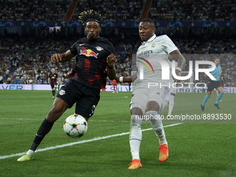 David Alaba centre-back of Real Madrid and Austria and Mohamed Simakan centre-back of RB Leipzig and France compete for the ball during the...