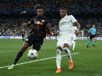 David Alaba centre-back of Real Madrid and Austria and Mohamed Simakan centre-back of RB Leipzig and France compete for the ball during the...