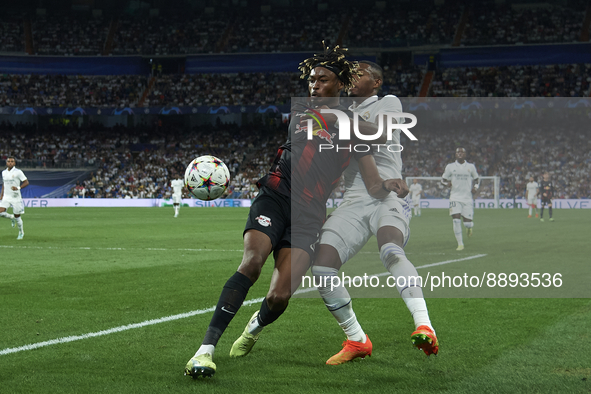 David Alaba centre-back of Real Madrid and Austria and Mohamed Simakan centre-back of RB Leipzig and France compete for the ball during the...