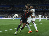 David Alaba centre-back of Real Madrid and Austria and Mohamed Simakan centre-back of RB Leipzig and France compete for the ball during the...