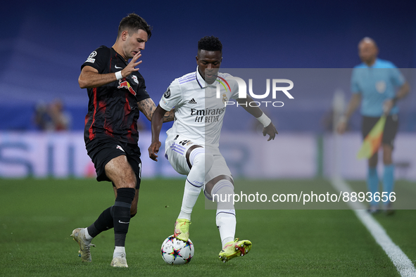 Vinicius Junior left winger of Real Madrid and Brazil and Dominik Szoboszlai attacking midfield of RB Leipzig and Hungary compete for the ba...