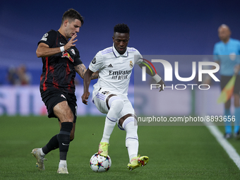 Vinicius Junior left winger of Real Madrid and Brazil and Dominik Szoboszlai attacking midfield of RB Leipzig and Hungary compete for the ba...