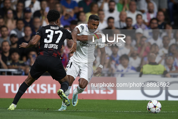 Rodrygo Goes right winger of Real Madrid and Brazil and Abdou Diallo centre-back of RB Leipzig and Senegal compete for the ball during the U...