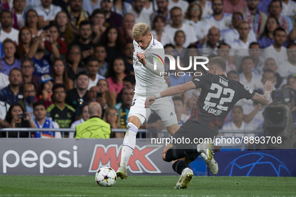 Federico Valverde central midfield of Real Madrid and Uruguay and David Raum left-back of RB Leipzig and Germany compete for the ball during...