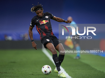 Mohamed Simakan centre-back of RB Leipzig and France controls the ball during the UEFA Champions League group F match between Real Madrid an...