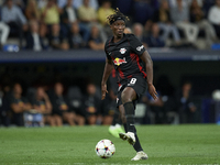 Amadou Haidara central midfield of RB Leipzig and Mali controls the ball during the UEFA Champions League group F match between Real Madrid...