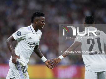 Vinicius Junior left winger of Real Madrid and Brazil and Rodrygo Goes right winger of Real Madrid and Brazil greet each other during the UE...