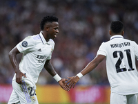 Vinicius Junior left winger of Real Madrid and Brazil and Rodrygo Goes right winger of Real Madrid and Brazil greet each other during the UE...