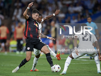 Dominik Szoboszlai attacking midfield of RB Leipzig and Hungary and David Alaba centre-back of Real Madrid and Austria compete for the ball...