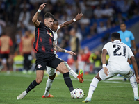 Dominik Szoboszlai attacking midfield of RB Leipzig and Hungary and David Alaba centre-back of Real Madrid and Austria compete for the ball...