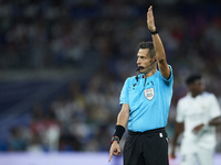 Referee Maurizio Mariani during the UEFA Champions League group F match between Real Madrid and RB Leipzig at Estadio Santiago Bernabeu on S...