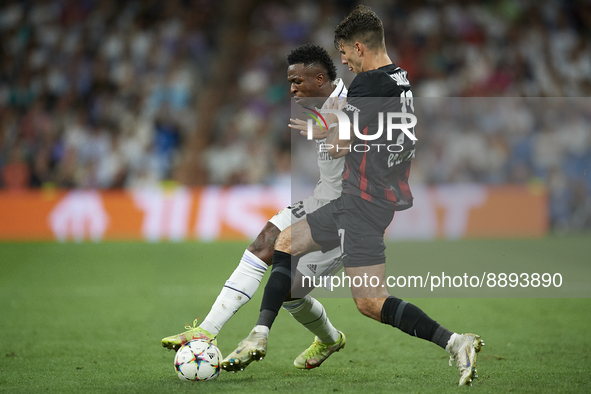 Vinicius Junior left winger of Real Madrid and Brazil in action and Dominik Szoboszlai attacking midfield of RB Leipzig and Hungary compete...