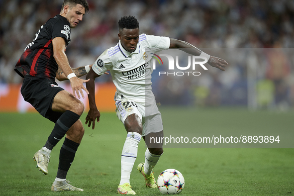 Vinicius Junior left winger of Real Madrid and Brazil in action and Dominik Szoboszlai attacking midfield of RB Leipzig and Hungary compete...