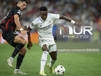 Vinicius Junior left winger of Real Madrid and Brazil in action and Dominik Szoboszlai attacking midfield of RB Leipzig and Hungary compete...