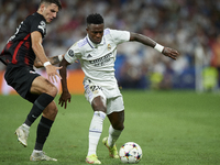 Vinicius Junior left winger of Real Madrid and Brazil in action and Dominik Szoboszlai attacking midfield of RB Leipzig and Hungary compete...