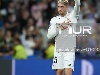 Federico Valverde central midfield of Real Madrid and Uruguay celebrates victory after the UEFA Champions League group F match between Real...