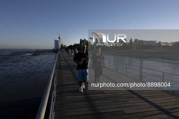 People are seen walking around the walkway of the Vasco da Gama bridge, Lisbon. September 22, 2022. 