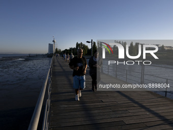 People are seen walking around the walkway of the Vasco da Gama bridge, Lisbon. September 22, 2022. (