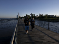 People are seen walking around the walkway of the Vasco da Gama bridge, Lisbon. September 22, 2022. (