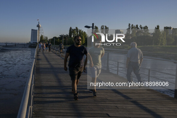 People are seen walking around the walkway of the Vasco da Gama bridge, Lisbon. September 22, 2022. 