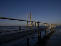 A person is seen walking around the walkway of the Vasco da Gama bridge, Lisbon. September 22, 2022. (