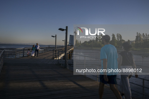 People are seen walking around the walkway of the Vasco da Gama bridge, Lisbon. September 22, 2022. 