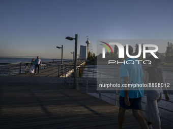 People are seen walking around the walkway of the Vasco da Gama bridge, Lisbon. September 22, 2022. (