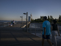 People are seen walking around the walkway of the Vasco da Gama bridge, Lisbon. September 22, 2022. (