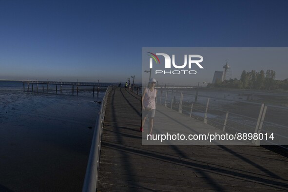 People are seen walking around the walkway of the Vasco da Gama bridge, Lisbon. September 22, 2022. 