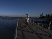 People are seen walking around the walkway of the Vasco da Gama bridge, Lisbon. September 22, 2022. (