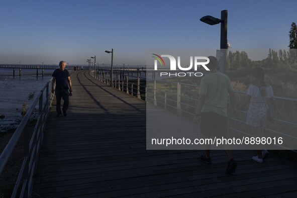 People are seen walking around the walkway of the Vasco da Gama bridge, Lisbon. September 22, 2022. 