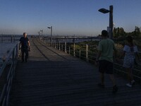 People are seen walking around the walkway of the Vasco da Gama bridge, Lisbon. September 22, 2022. (