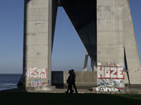 People are seen walking around the walkway of the Vasco da Gama bridge, Lisbon. September 22, 2022. (