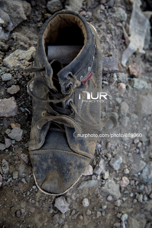 Men's leather boot found near Eftalou on the island of Lesbos.  Shoes found on the beaches and around the Greek island where thousands of im...