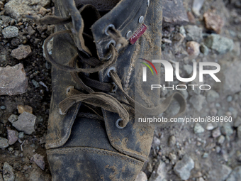 Men's leather boot found near Eftalou on the island of Lesbos.  Shoes found on the beaches and around the Greek island where thousands of im...