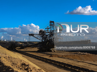 general view of a bucket wheel excavator at the Garzweiler open coal mind in Juenchen, as from the background of steam rising from cooling t...