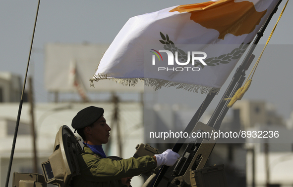 A soldier in an armored personnel carrier with the image of the Cypriot flag during the annual military parade to mark the Independence Day...