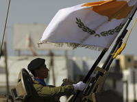 A soldier in an armored personnel carrier with the image of the Cypriot flag during the annual military parade to mark the Independence Day...