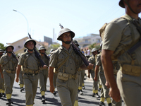 Soldiers march in a military parade marking the 61st anniversary of Cyprus' independence from British colonial rule in Nicosia on the divide...