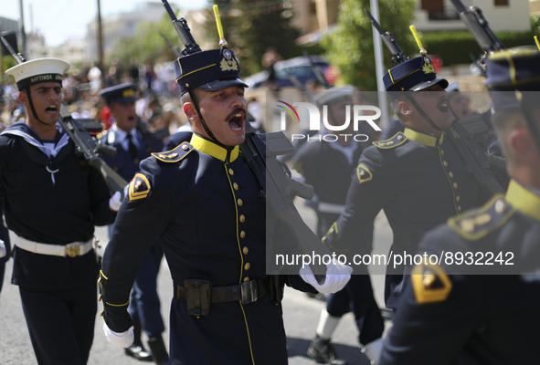 Soldiers march in a military parade marking the 61st anniversary of Cyprus' independence from British colonial rule in Nicosia on the divide...