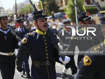 Soldiers march in a military parade marking the 61st anniversary of Cyprus' independence from British colonial rule in Nicosia on the divide...