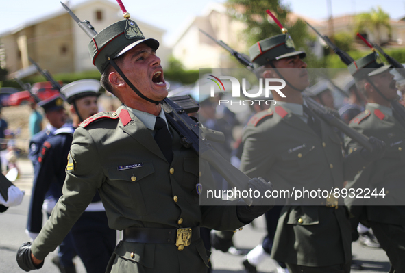 Soldiers march in a military parade marking the 61st anniversary of Cyprus' independence from British colonial rule in Nicosia on the divide...