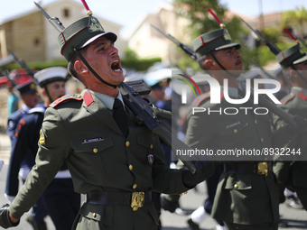 Soldiers march in a military parade marking the 61st anniversary of Cyprus' independence from British colonial rule in Nicosia on the divide...