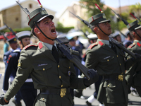 Soldiers march in a military parade marking the 61st anniversary of Cyprus' independence from British colonial rule in Nicosia on the divide...